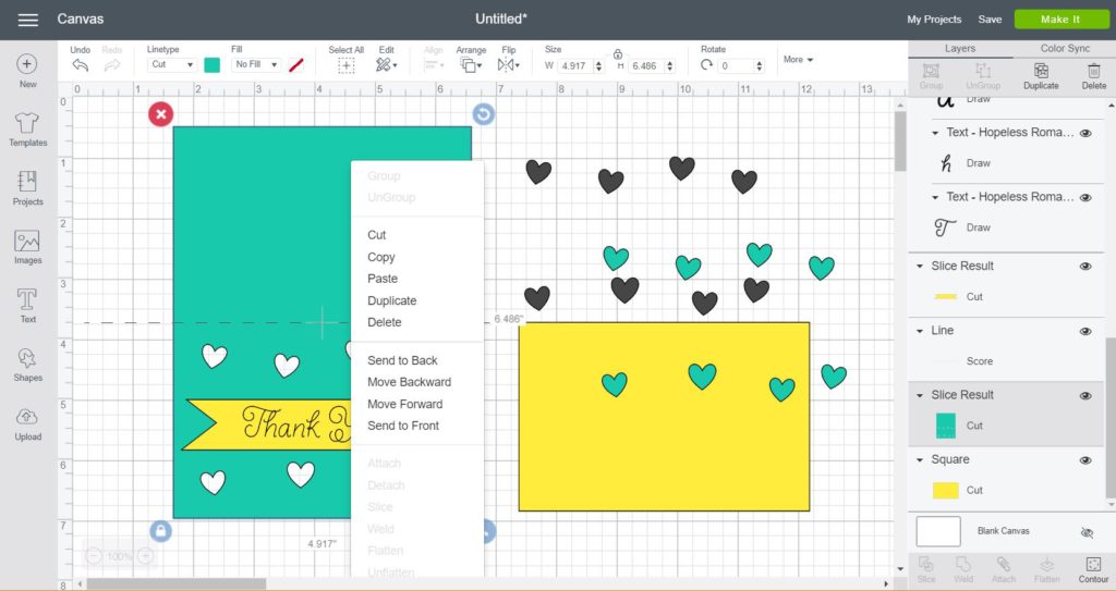 Slicing hearts against the card to make a cut out card